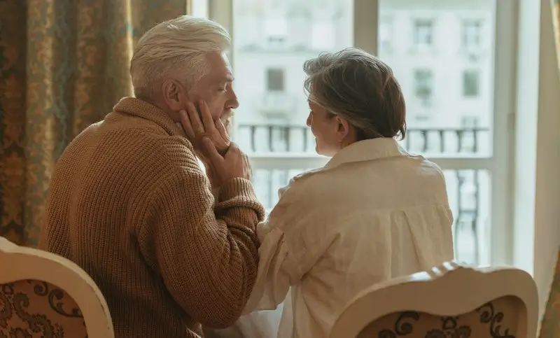 Elderly couple sharing a quiet moment, highlighting the peace of mind that comes with independent retirement financial advice.