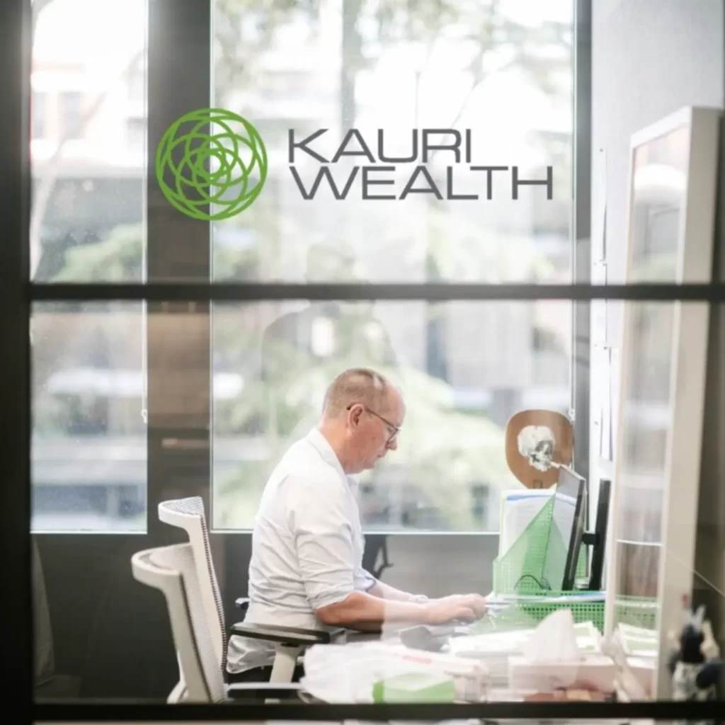 Financial adviser at Kauri Wealth working on your finances — trusted provider of retirement and income planning Australia with a proven track record.